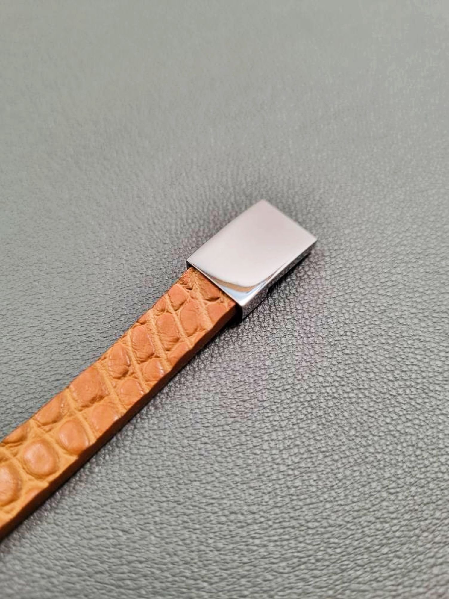 Cognac crocodile leather bracelet with a silver magnetic clasp, made by Pila Luxuria in Canada.