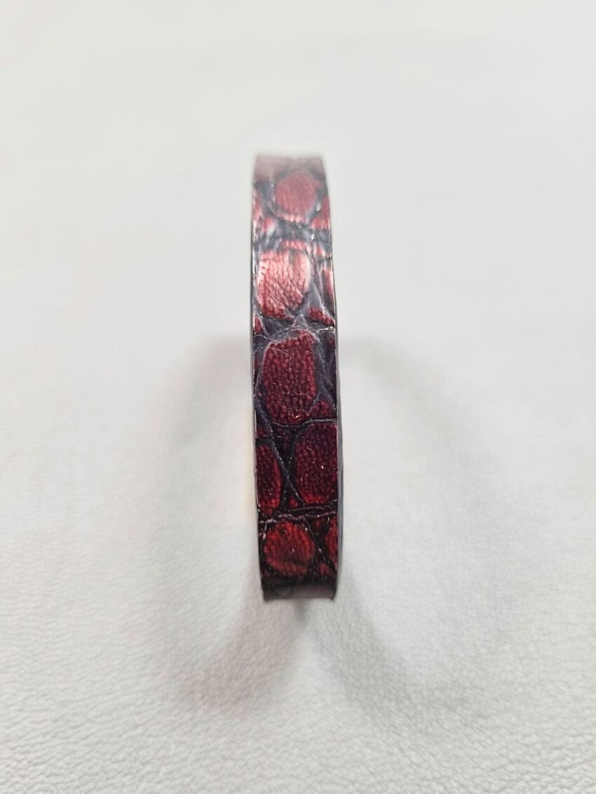 Forward view of a luxury black and red alligator leather bracelet with a magnetic clasp, made by Pila Luxuria in Canada.