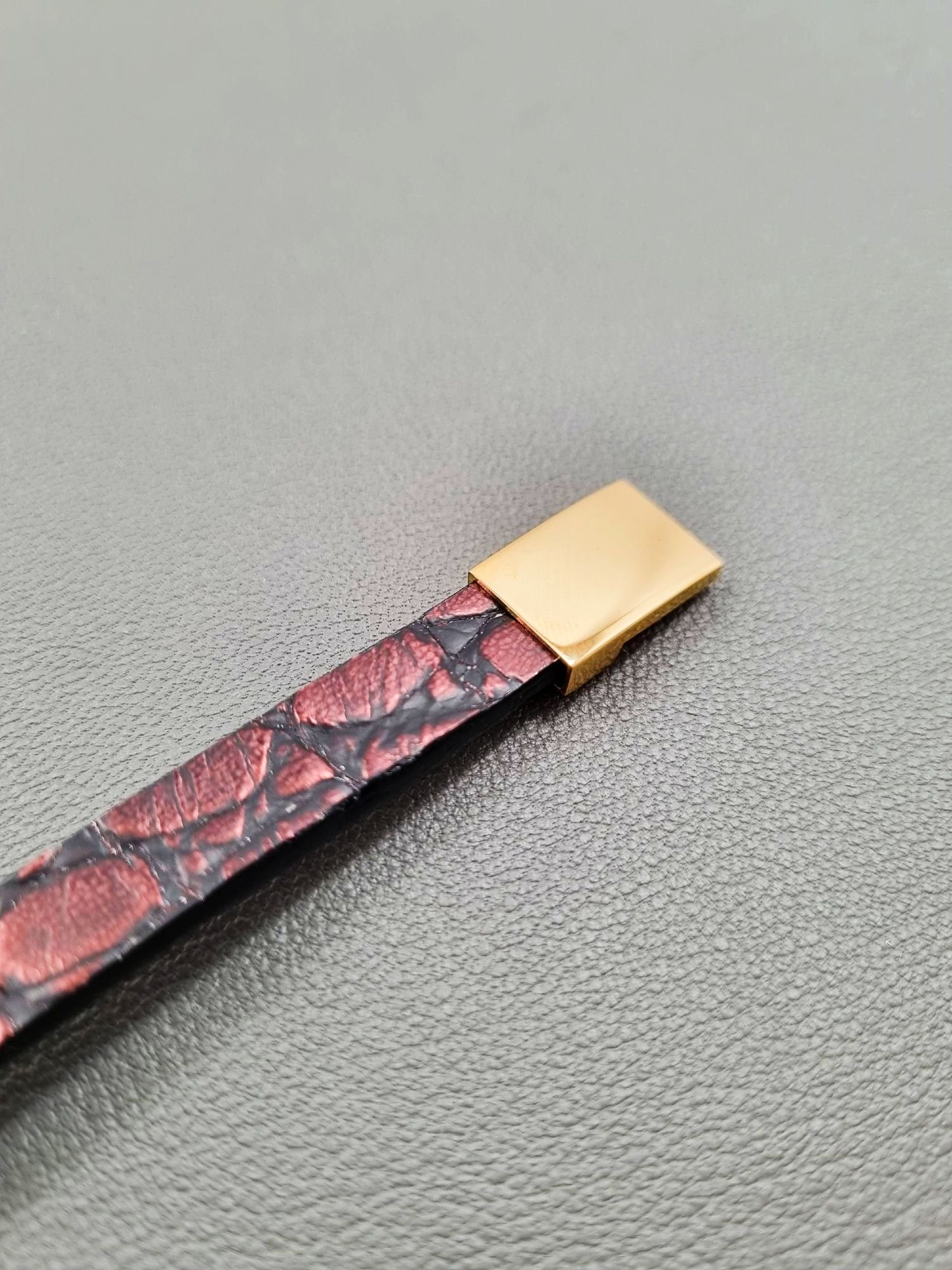 Alligator leather bracelet with a gold magnetic clasp, made by Pila Luxuria in Canada.