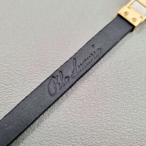 Embossed logo of a luxury black cherry alligator leather bracelet with a magnetic clasp, made by Pila Luxuria in Canada.