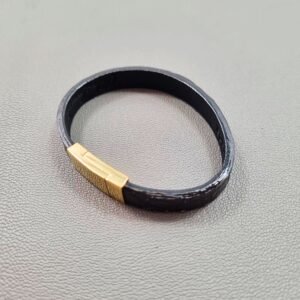 Top view of a luxury black and red alligator leather bracelet with a magnetic clasp, made by Pila Luxuria in Canada.