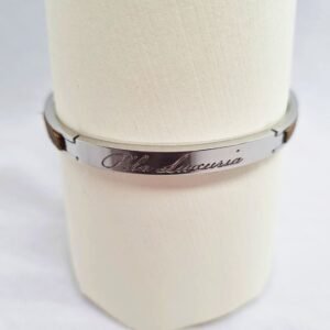 Stainless steel bracelet with etoupe epsom leather inlay and Pila Luxuria script.