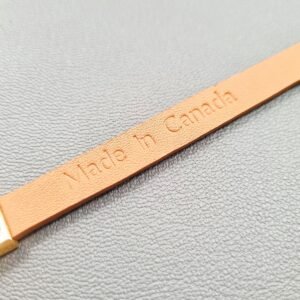 Made in Canada logo of a luxury green shark leather bracelet with a magnetic clasp, made by Pila Luxuria in Canada.