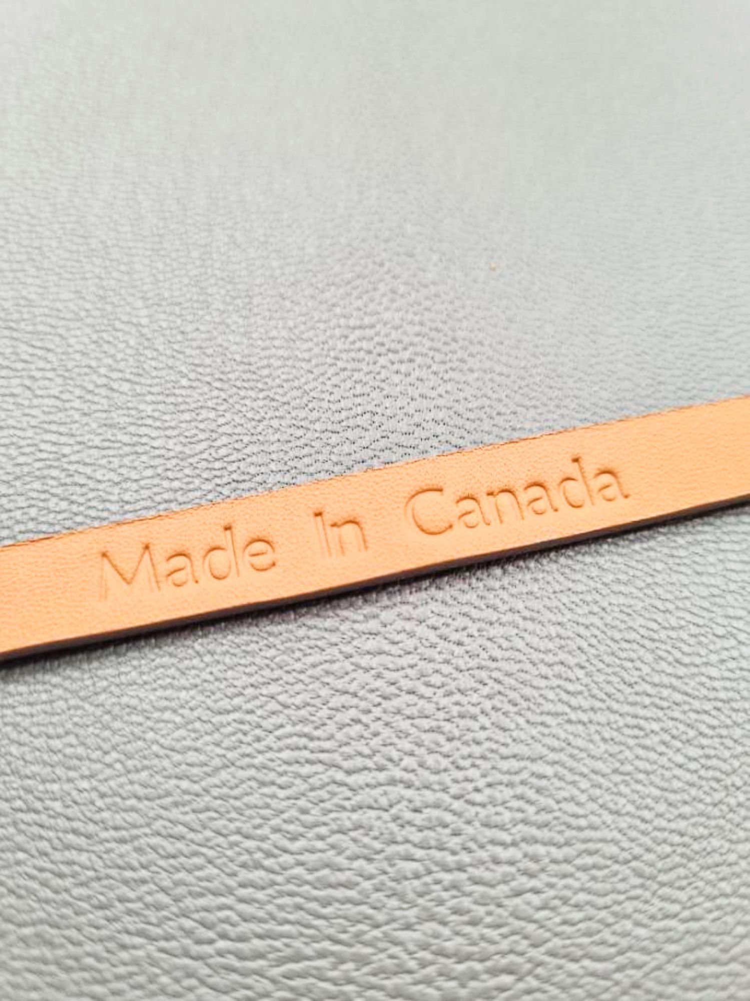 Made in Canada embossed in a grey crocodile clasp bracelet, made by Pila Luxuria in Canada.