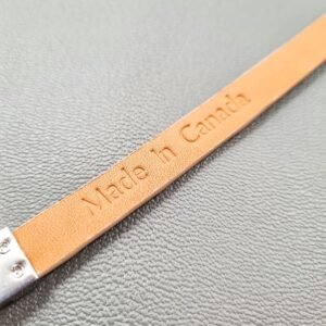 Embosed Made in Canada logo on a luxury himalayan crocodile bracelet with a magnetic clasp, made by Pila Luxuria in Canada.