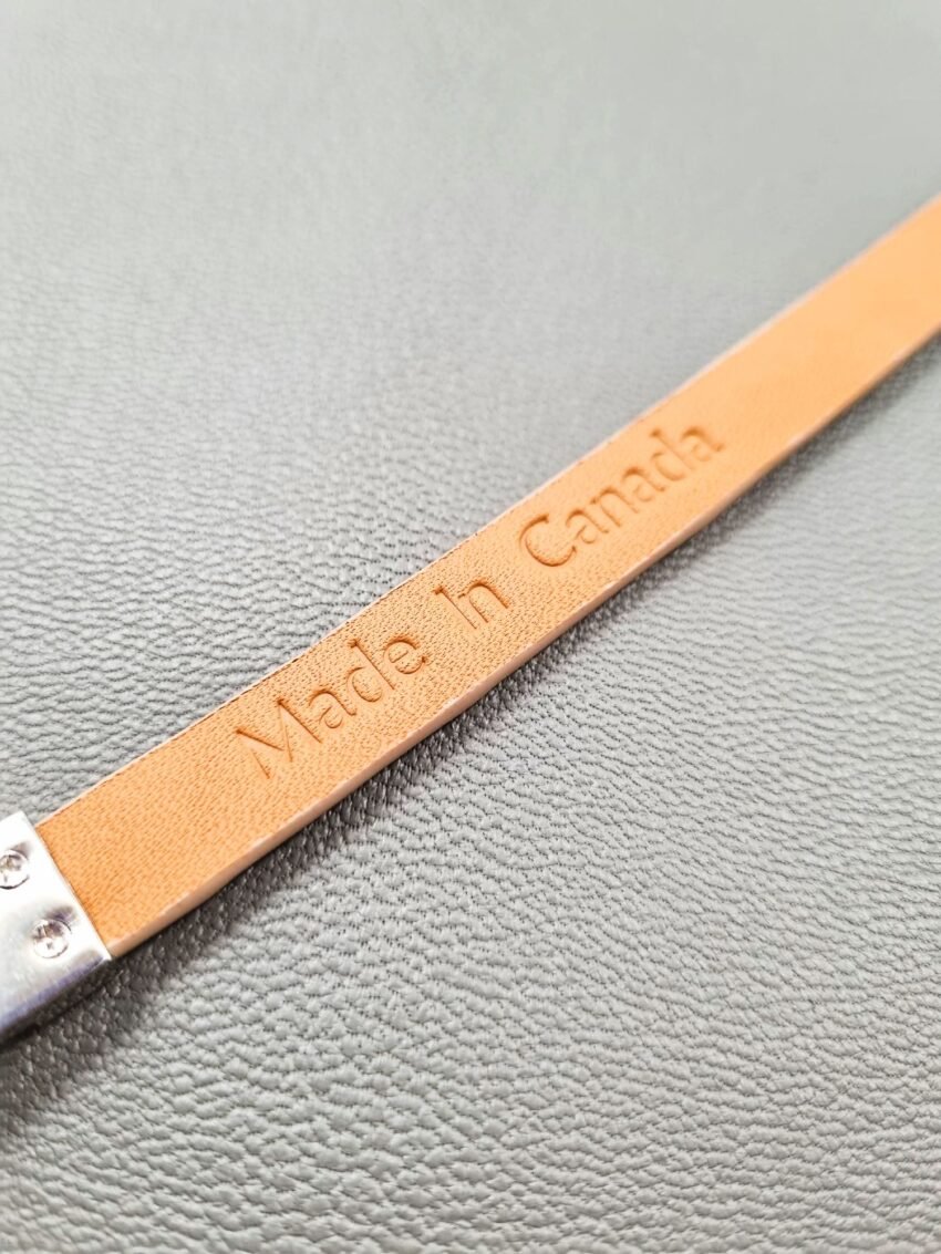 Embosed Made in Canada logo on a luxury himalayan crocodile bracelet with a magnetic clasp, made by Pila Luxuria in Canada.