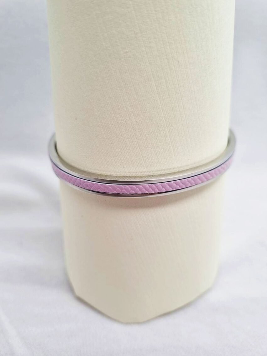 Stainless steel bracelet with pink caviar leather inlay.