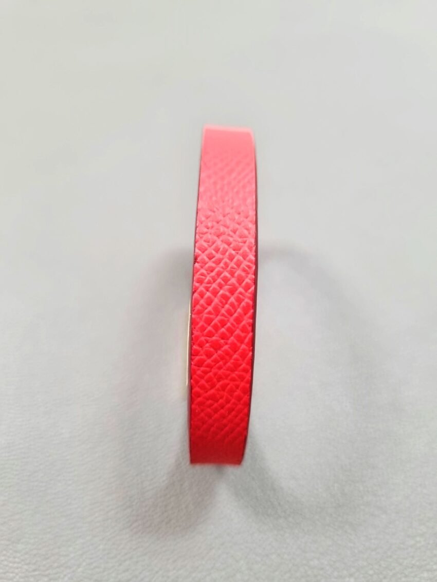Forward view of a luxury red epsom leather bracelet with a magnetic clasp, made by Pila Luxuria in Canada.