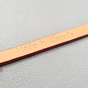 Made In Canada logo of a luxury red epsom leather bracelet with a magnetic clasp, made by Pila Luxuria in Canada.
