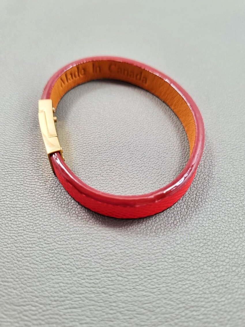 Top view of a luxury red epsom leather bracelet with a magnetic clasp, made by Pila Luxuria in Canada.