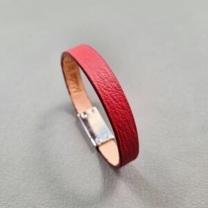 Angled view of a luxury red goatskin leather bracelet with a magnetic clasp, made by Pila Luxuria in Canada.