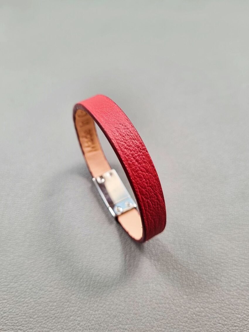 Angled view of a luxury red goatskin leather bracelet with a magnetic clasp, made by Pila Luxuria in Canada.
