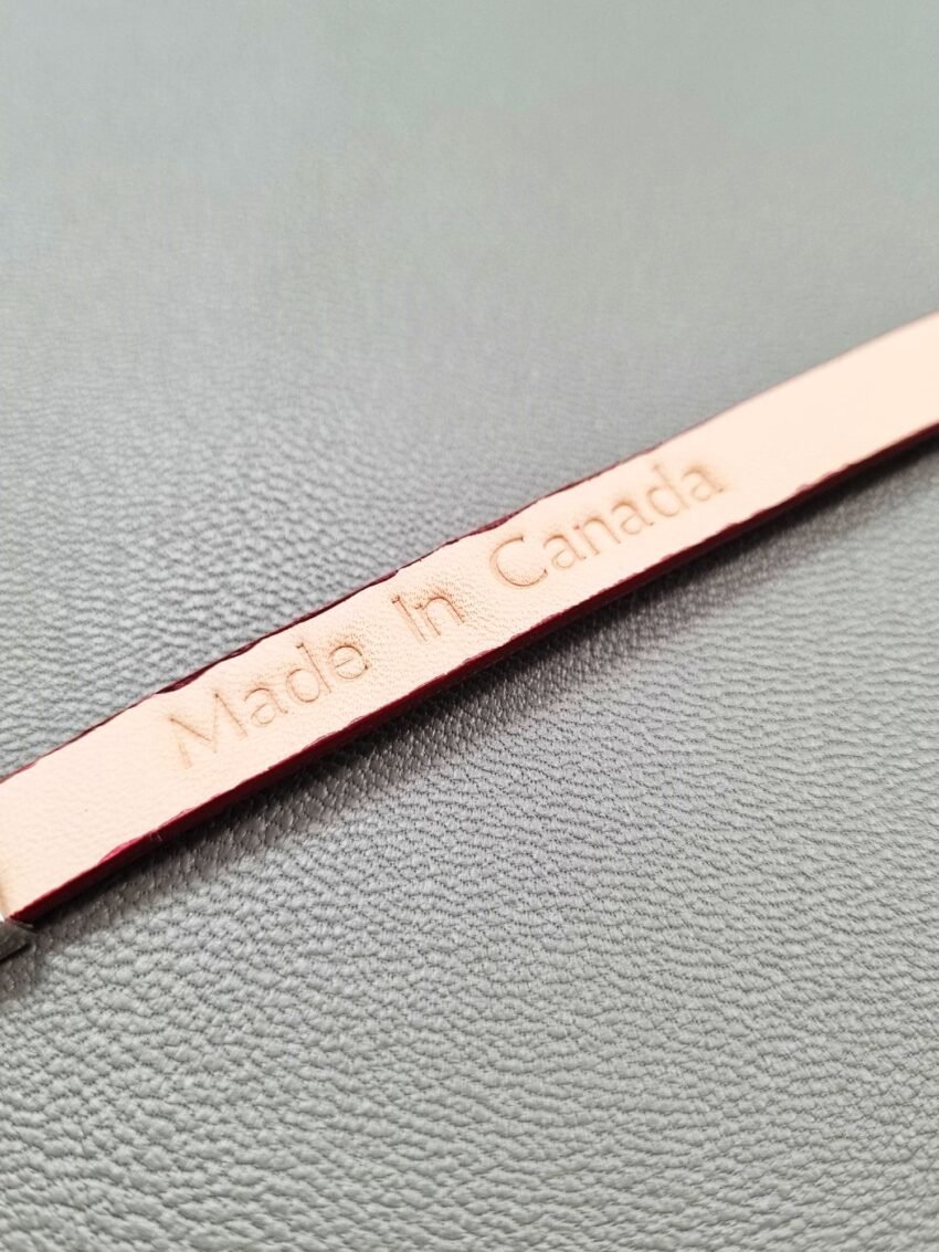 Made In Canada logo of a luxury red goatskin leather bracelet with a magnetic clasp, made by Pila Luxuria in Canada.