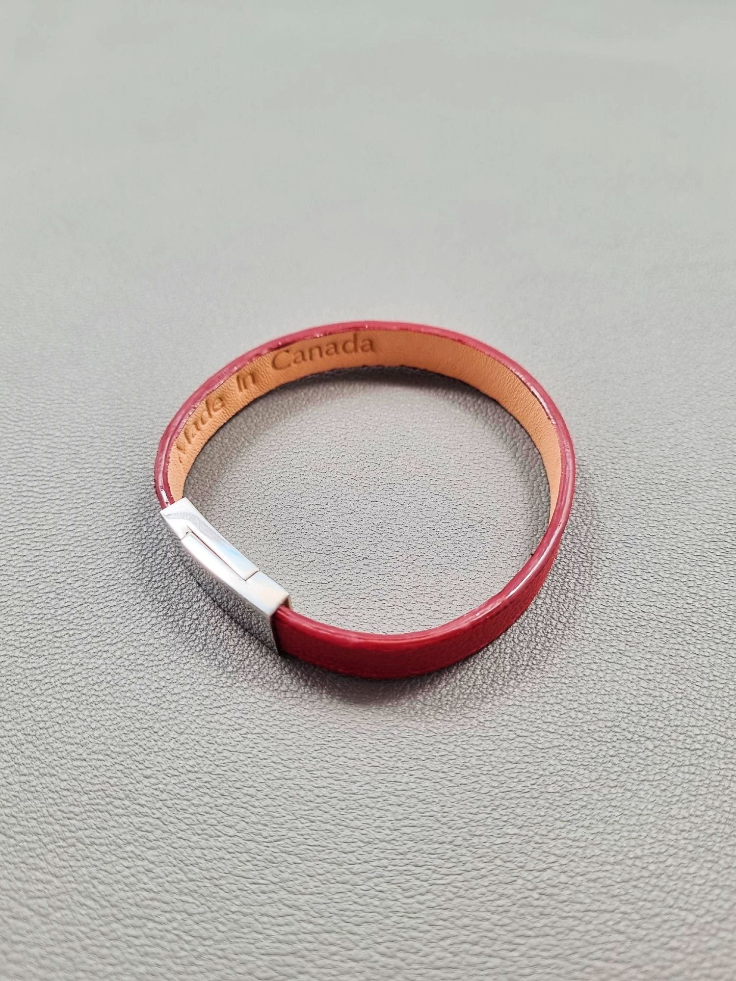 Top view of a luxury red goatskin leather bracelet with a magnetic clasp, made by Pila Luxuria in Canada.