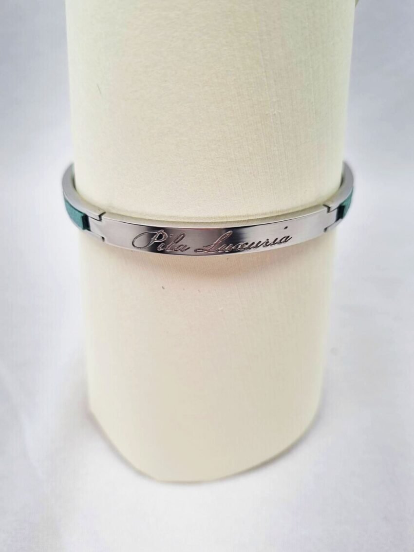 Tiffany color saffiano leather metal clasp bracelet made by Pila Luxuria in Canada showing brand logo.