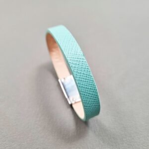 Angled view of a luxury tiffany saffiano leather bracelet with a magnetic clasp, made by Pila Luxuria in Canada.