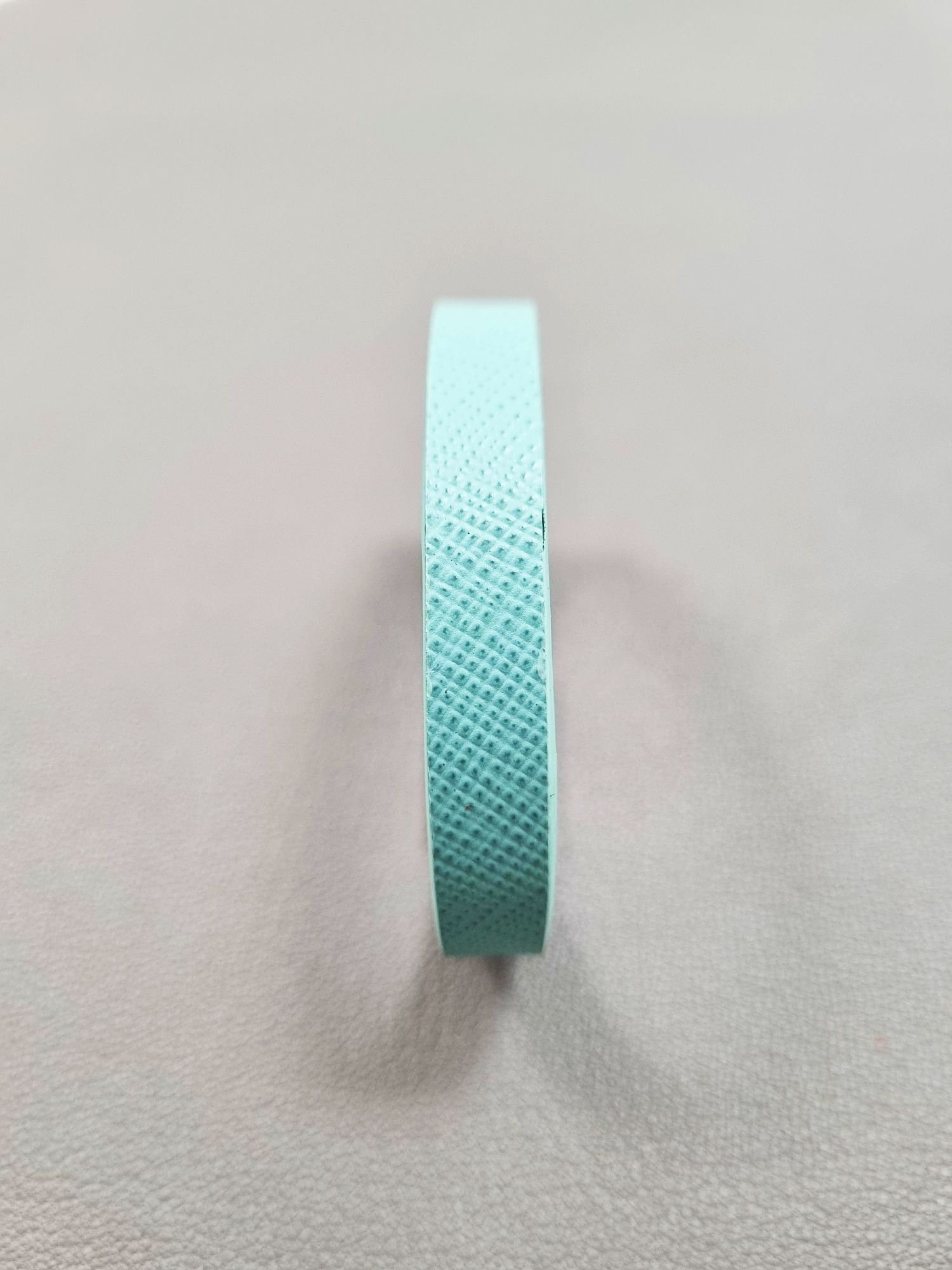 Front view of a luxury tiffany saffiano leather bracelet with a magnetic clasp, made by Pila Luxuria in Canada.