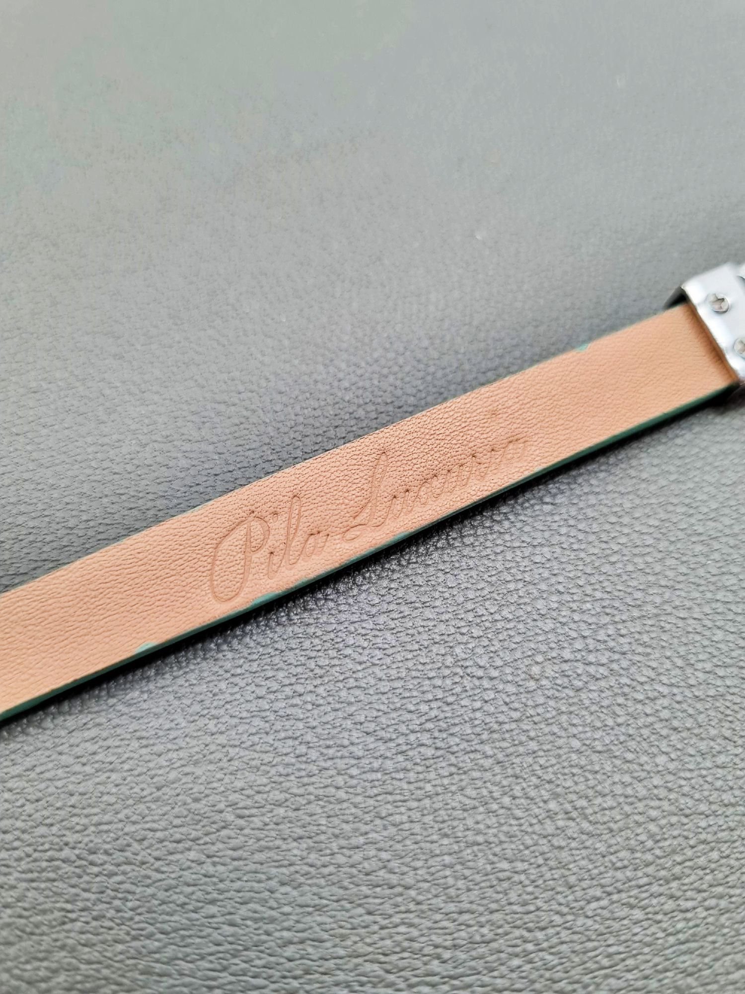 Made In Canada logo of a luxury tiffany saffiano leather bracelet with a magnetic clasp, made by Pila Luxuria in Canada.