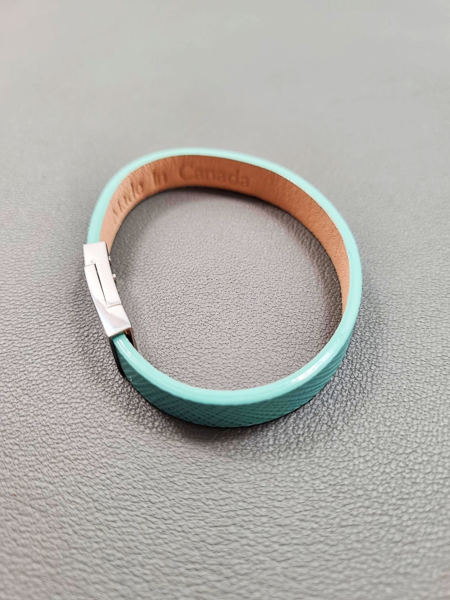 Top view of a luxury tiffany saffiano leather bracelet with a magnetic clasp, made by Pila Luxuria in Canada.