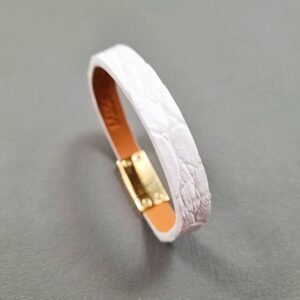 Angled view of a luxury white crocodile leather bracelet with a magnetic clasp, made by Pila Luxuria in Canada.