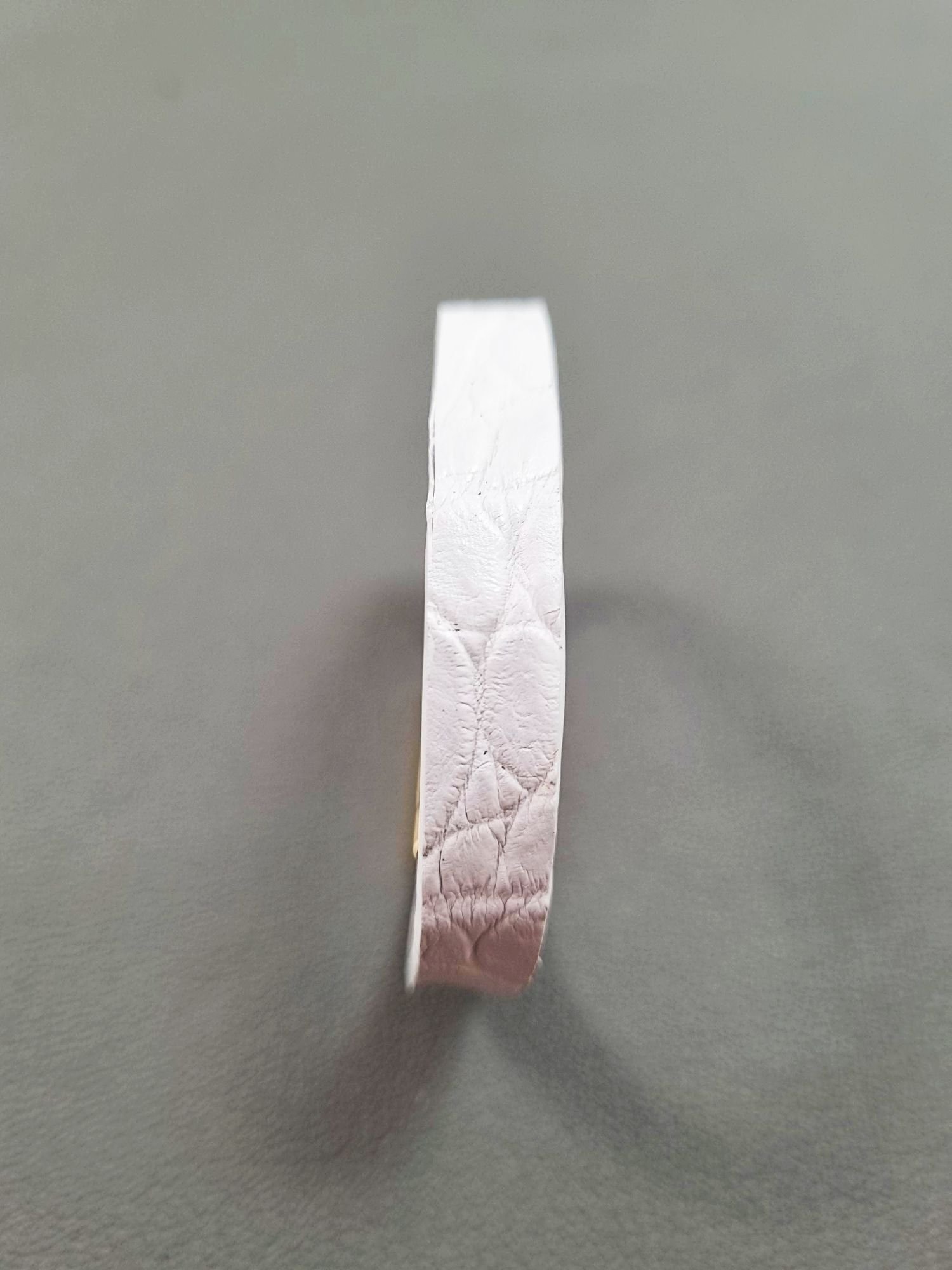 Forward view of a luxury white crocodile leather bracelet with a magnetic clasp, made by Pila Luxuria in Canada.