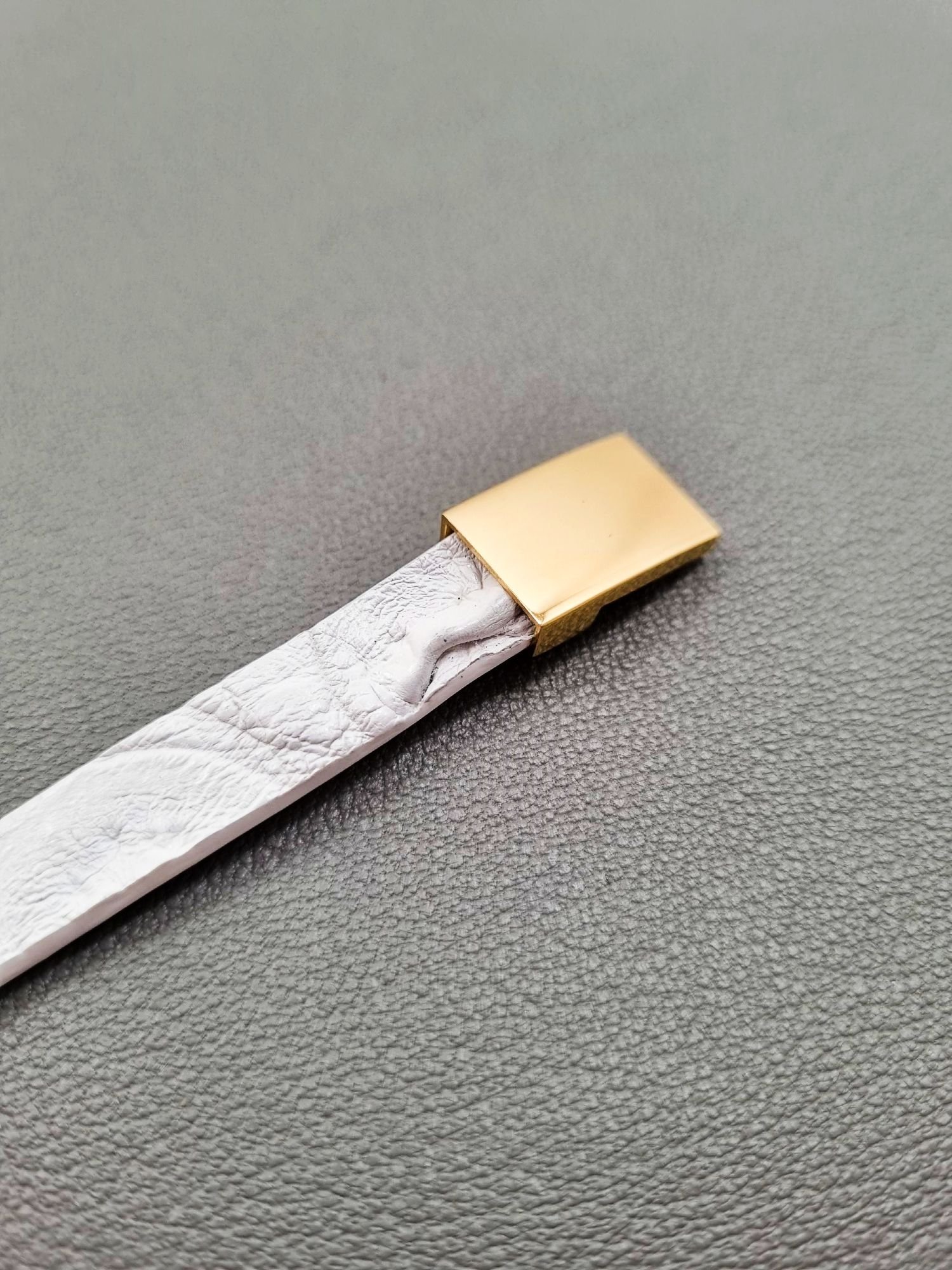 White crocodile lleather bracelet with a gold magnetic clasp, made by Pila Luxuria in Canada.