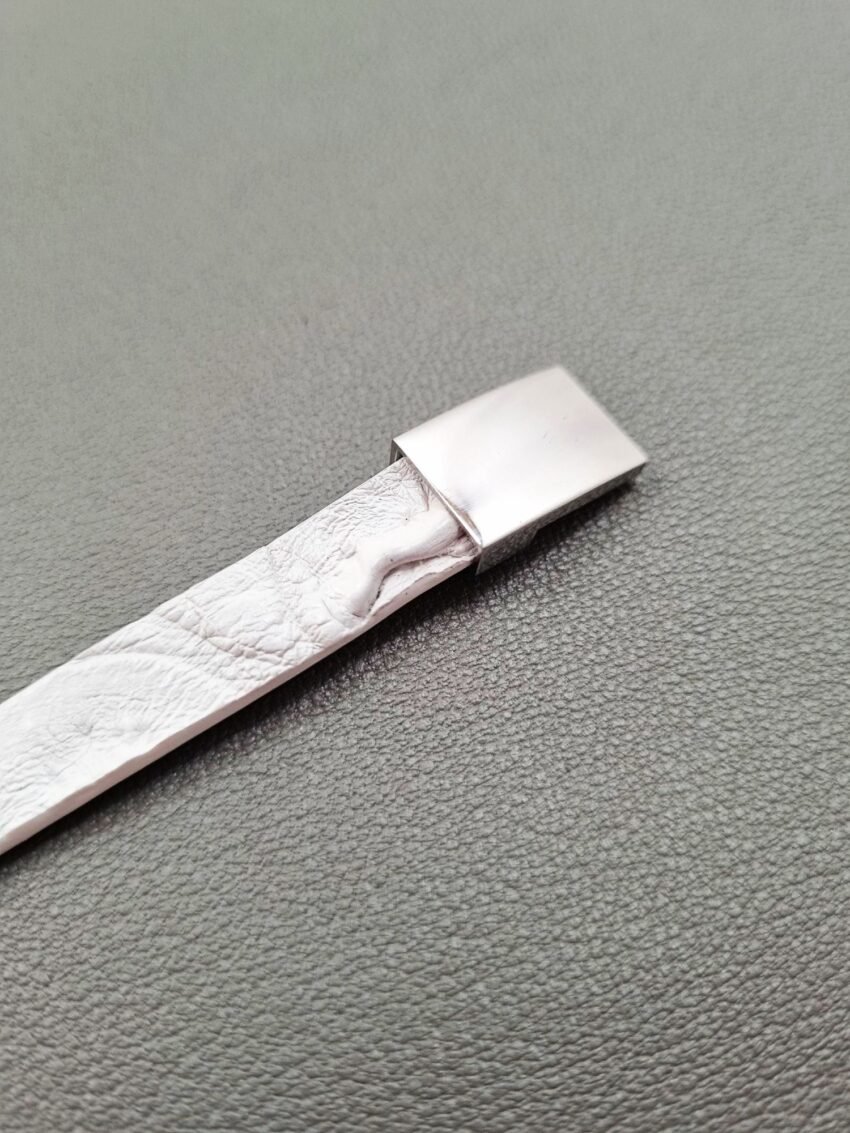 White crocodile lleather bracelet with a silver magnetic clasp, made by Pila Luxuria in Canada.