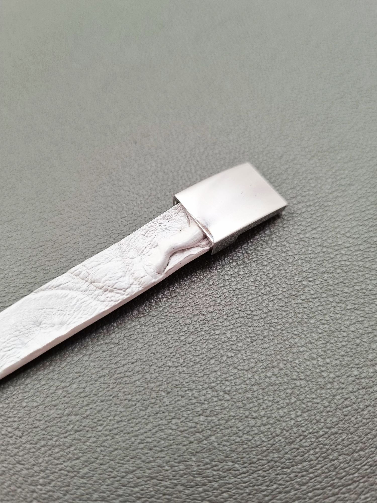 White crocodile lleather bracelet with a silver magnetic clasp, made by Pila Luxuria in Canada.