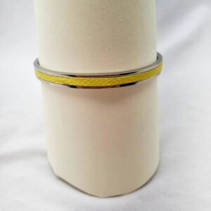 Stainless steel bracelet with yellow epsom leather inlay.