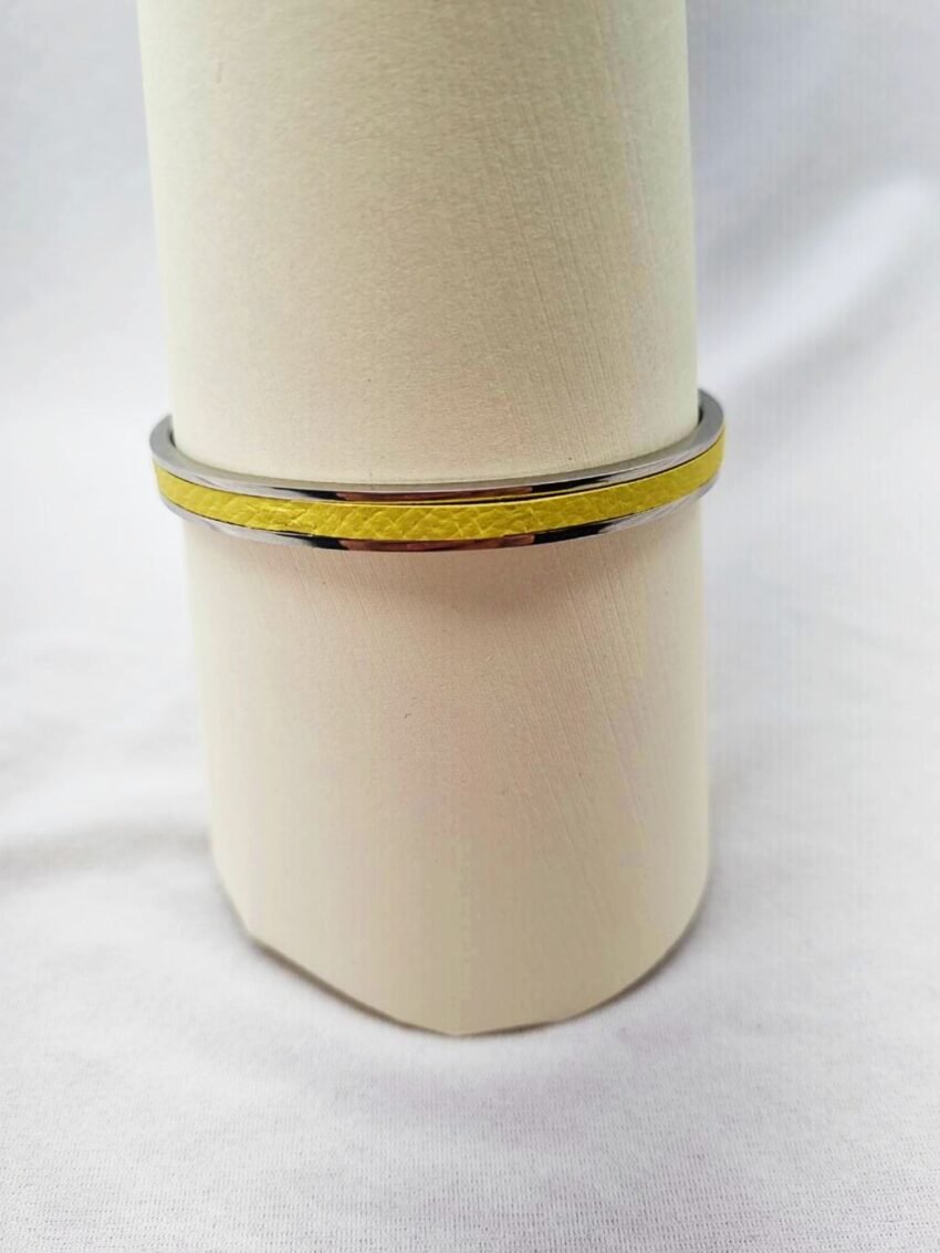 Stainless steel bracelet with yellow epsom leather inlay.