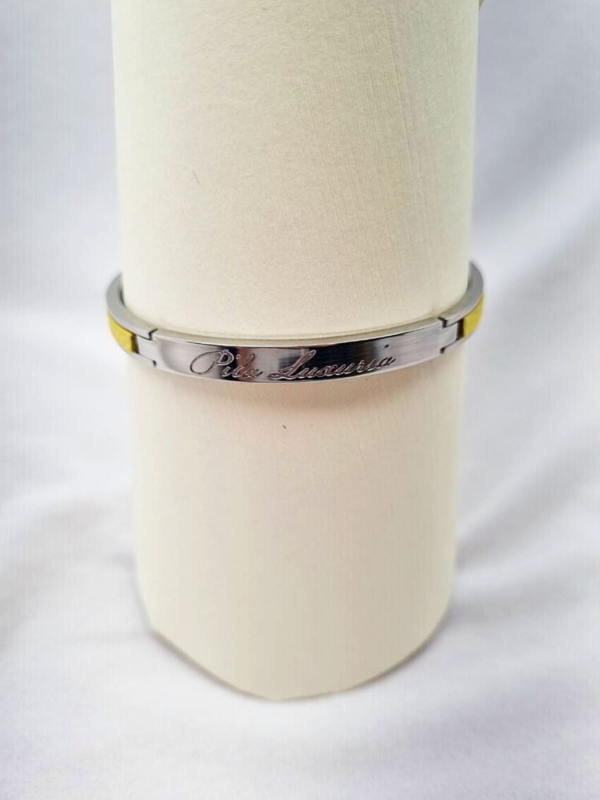 Stainless steel bracelet with yellow epsom leather and Pila Luxuria inscribed logo.